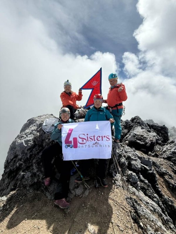Four Sherpa daughters scale Carstenstz Pyramid for a record 7 summits bid