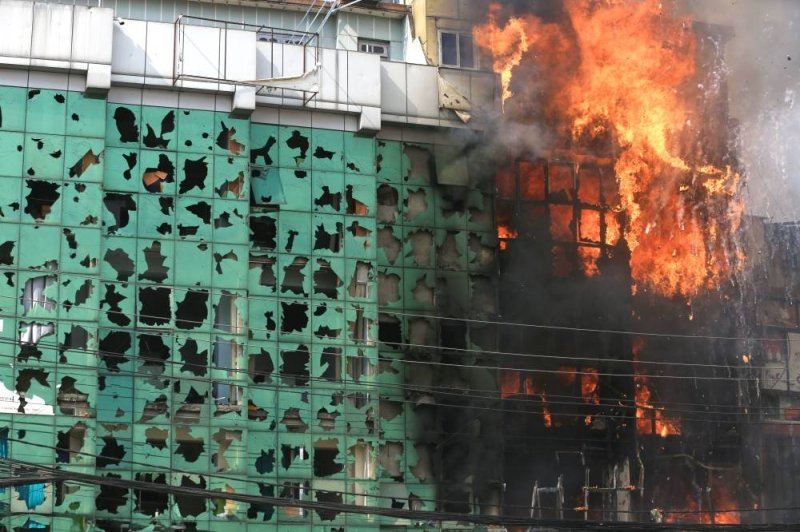 Journalist burned to death, media houses targeted by protesters