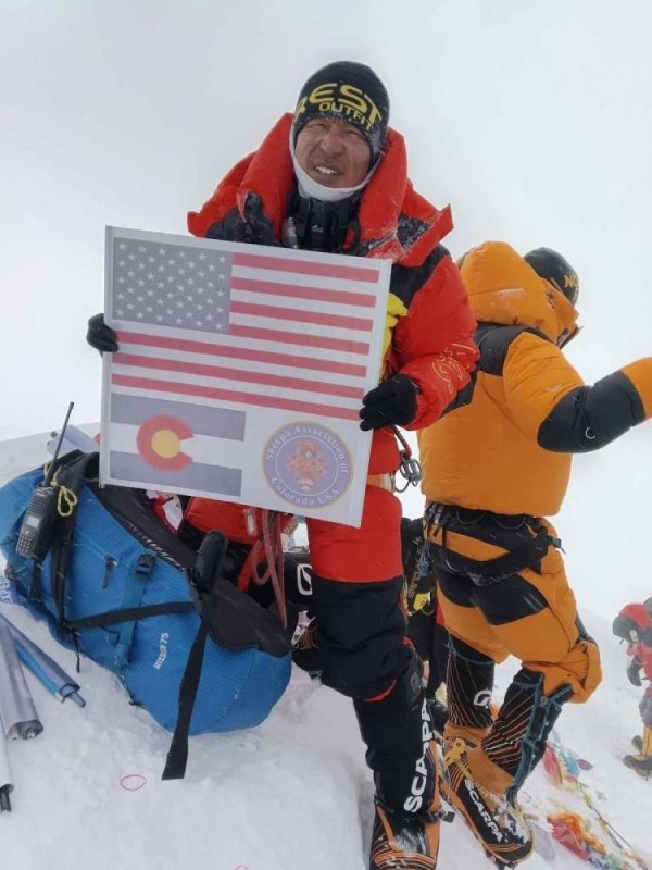 Pemba Rita scales Everest with Colorado Sherpa Association's banner