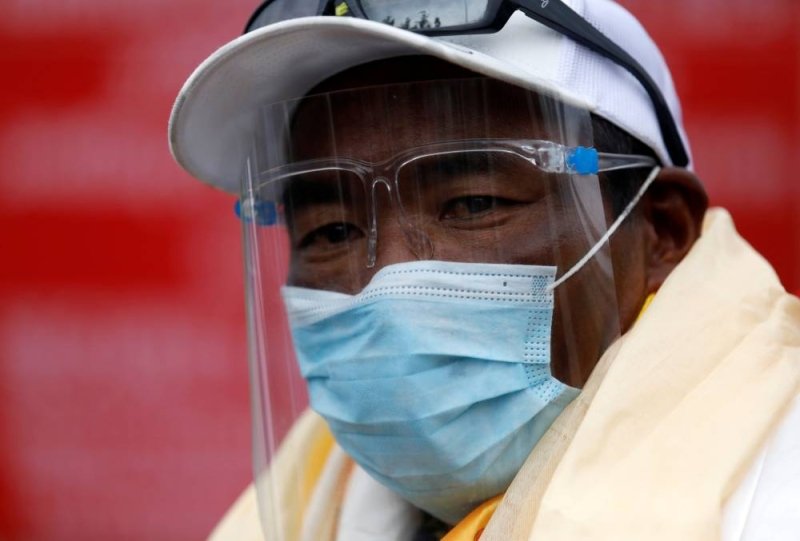 Record-breaking Sherpa says mountain goddess warned him from 26th Everest ascent