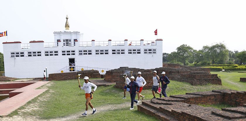 Torches from Lumbini's peace lamp being taken to Everest